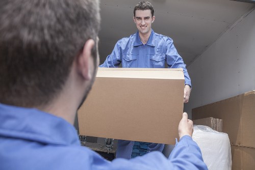 Removal van moving boxes in Finchley residential street