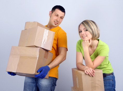 Crew securing items inside a removal van
