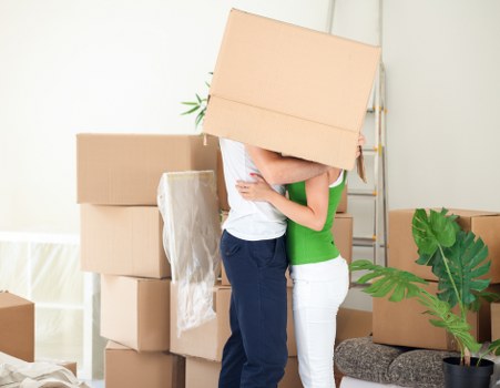 Removal crew loading boxes for a house move in Finchley