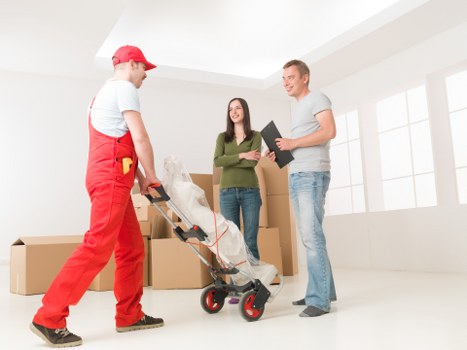 Packed moving boxes and furniture prepared for removals in Finchley