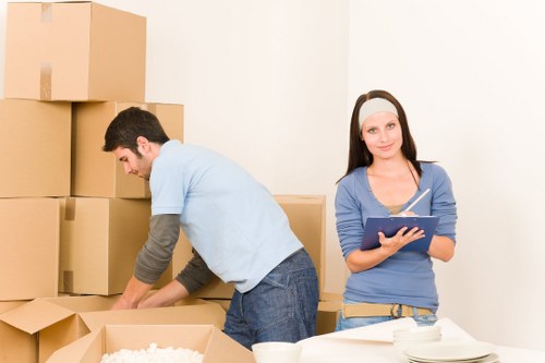 Removal crew wearing PPE while moving items carefully