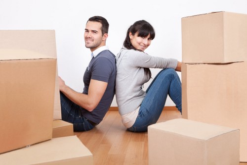 Professional movers handling household items in Finchley